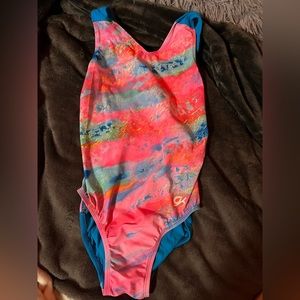 pink and blue GK elite gymnastics leotard